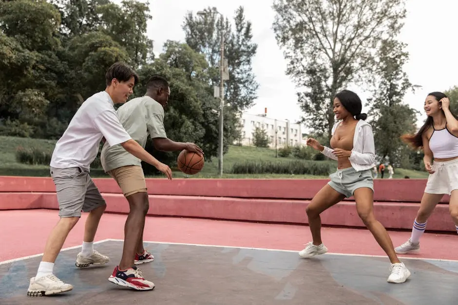 Young diverse friends playing basketball on park court