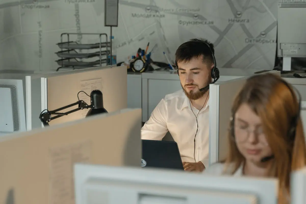 Dedicated call center agents working diligently at their desks in an office.