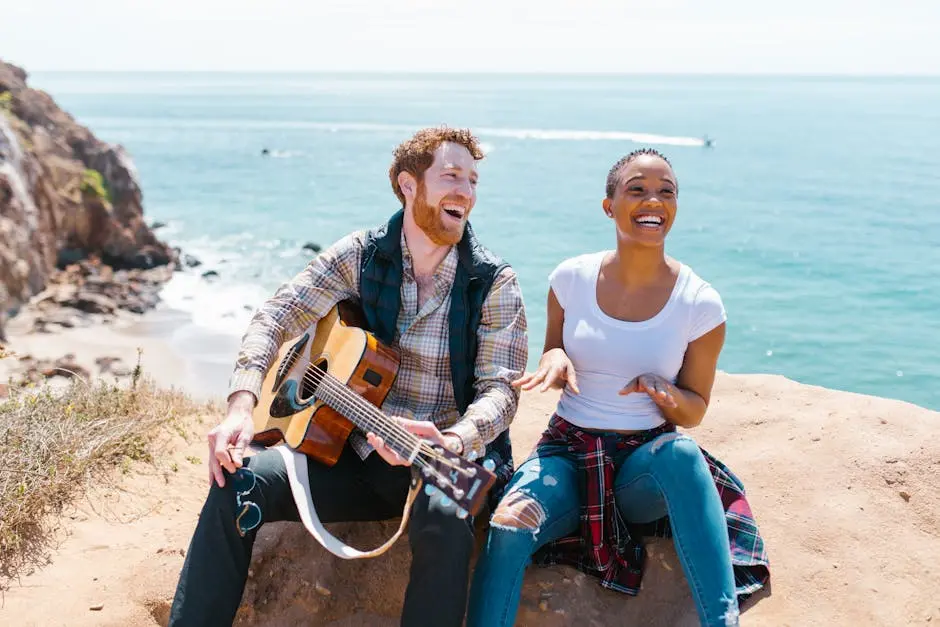 Man and Woman Sitting on Beach Shore