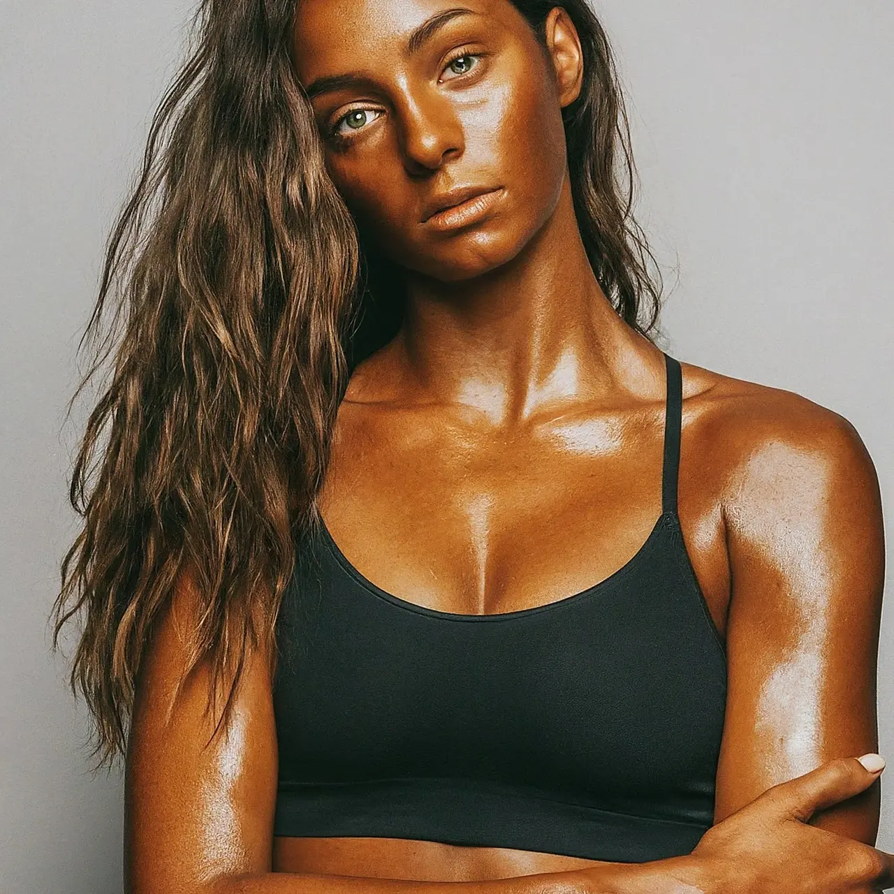 A spray tan kit with a glowing dark tan result. 35mm stock photo