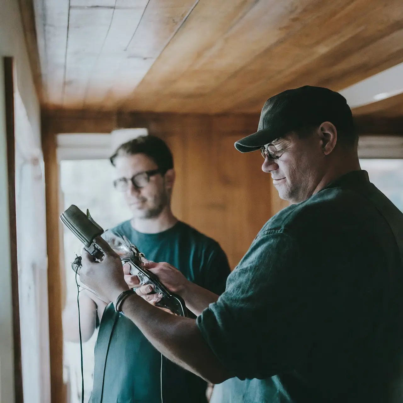 Technicians inspecting air ducts with professional equipment in a home. 35mm stock photo