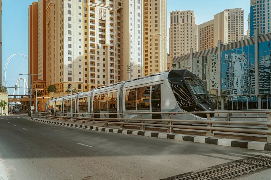 A sleek tram reflecting the urban skyline of Dubai, United Arab Emirates.