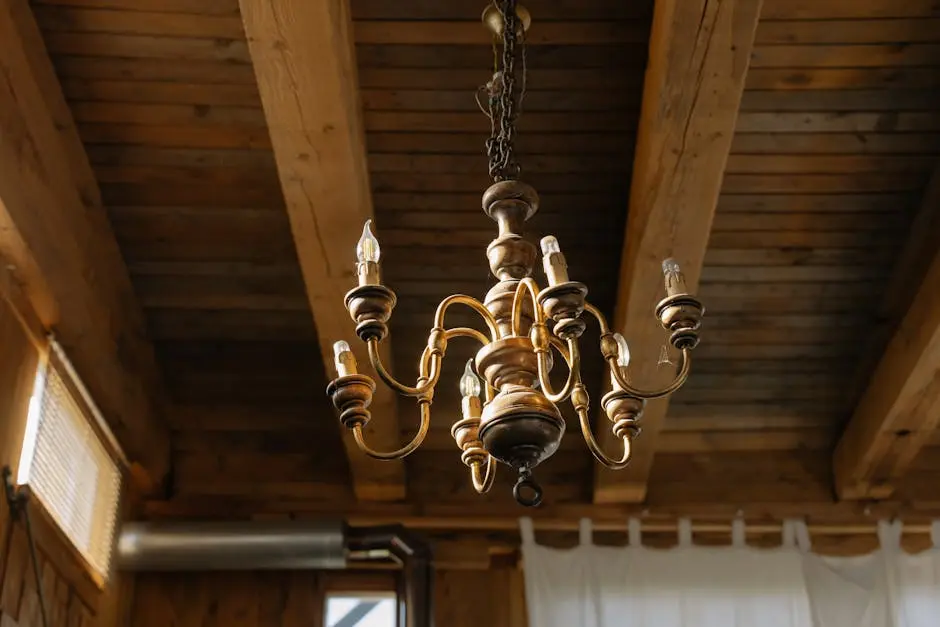 Elegant chandelier hanging from a rustic wooden ceiling, capturing a classic and antique interior decor.