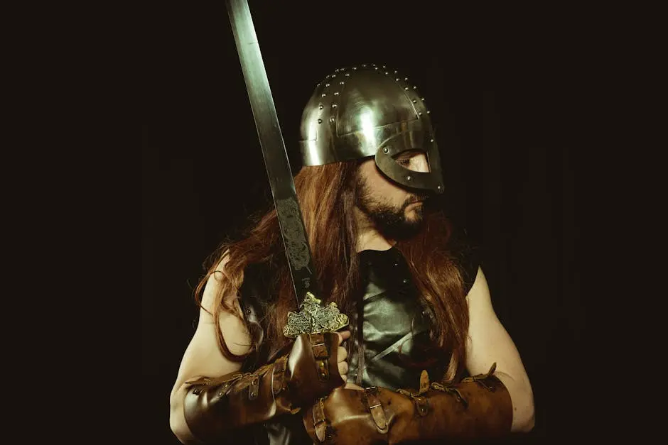 A medieval warrior wearing a helmet and leather armor, holding a sword, embodying the Viking spirit.