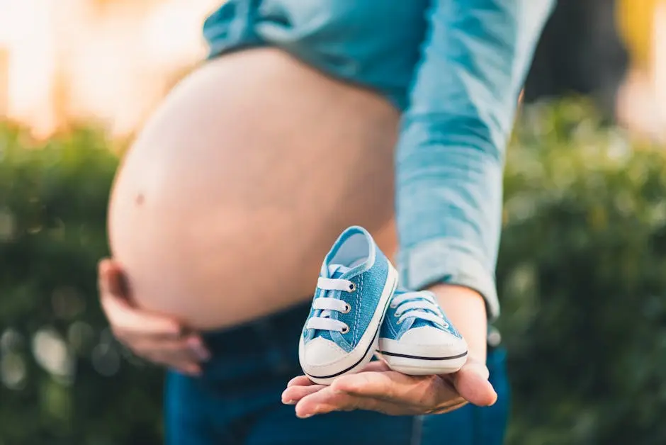 Pregnant woman holding baby shoes, symbolizing upcoming motherhood. Captures joyful anticipation.