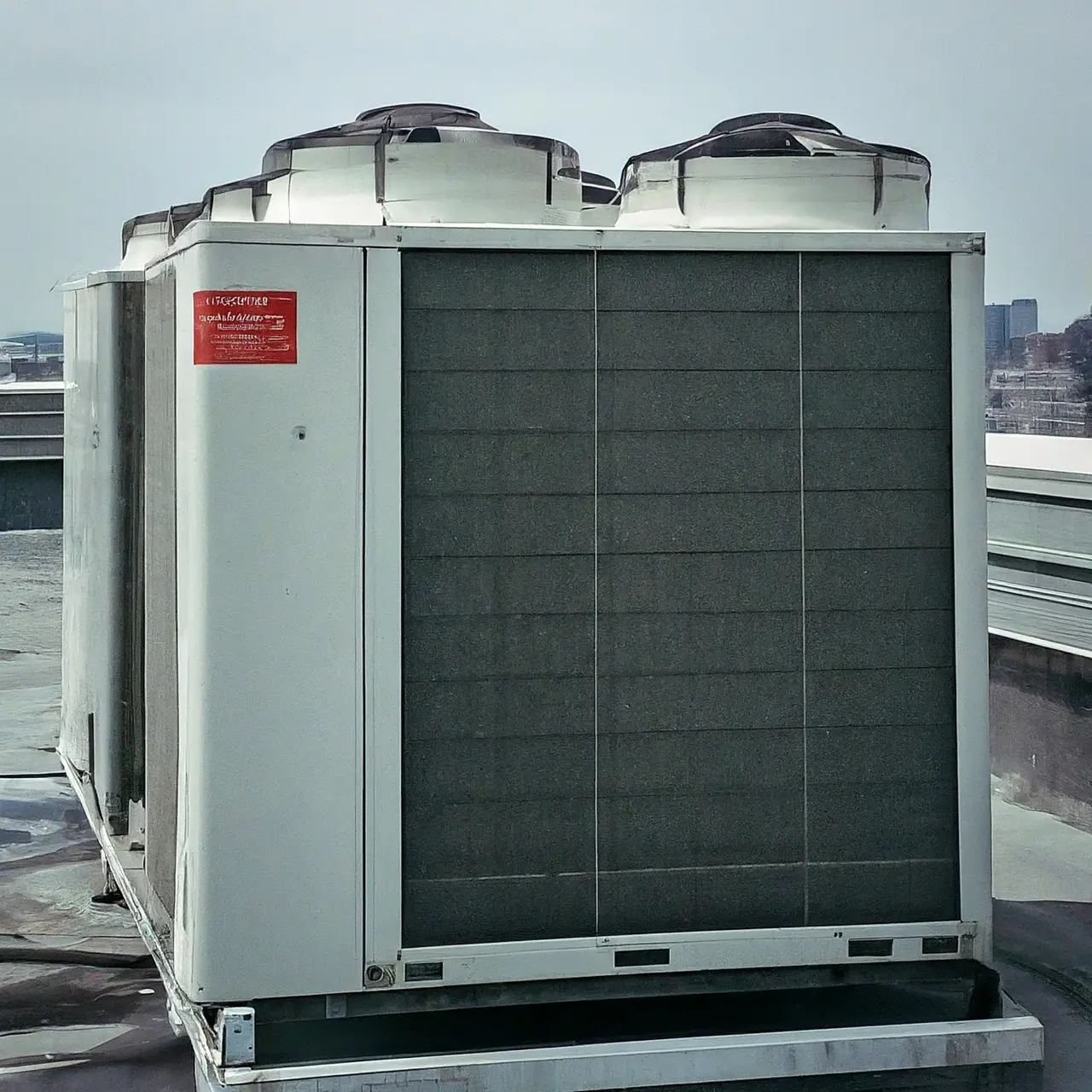 A high-efficiency commercial air conditioning unit on a rooftop. 35mm stock photo