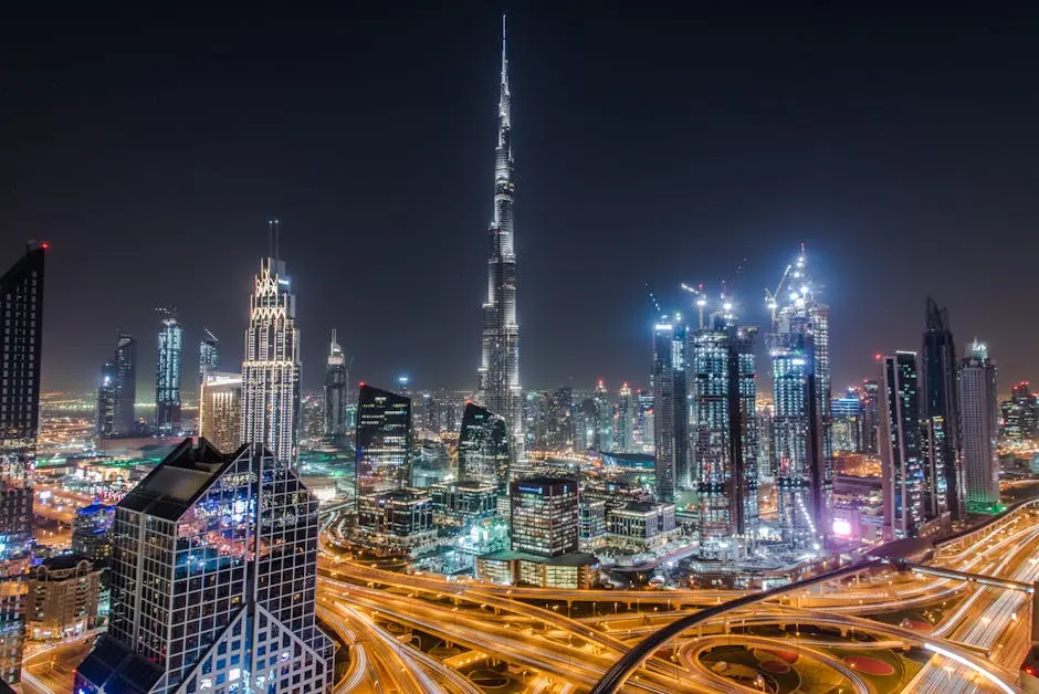 A stunning view of Dubai’s illuminated skyline featuring the towering Burj Khalifa at night.