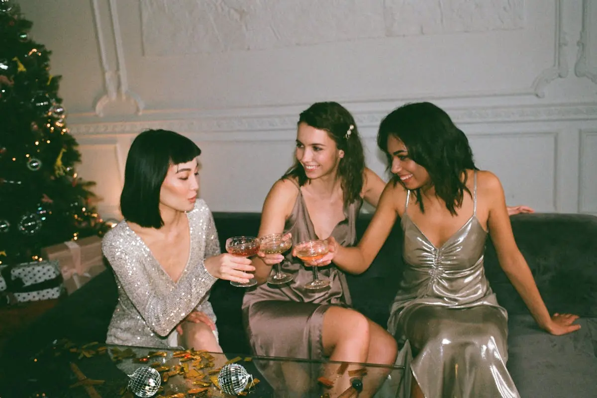 Three Women Sitting on a Sofa