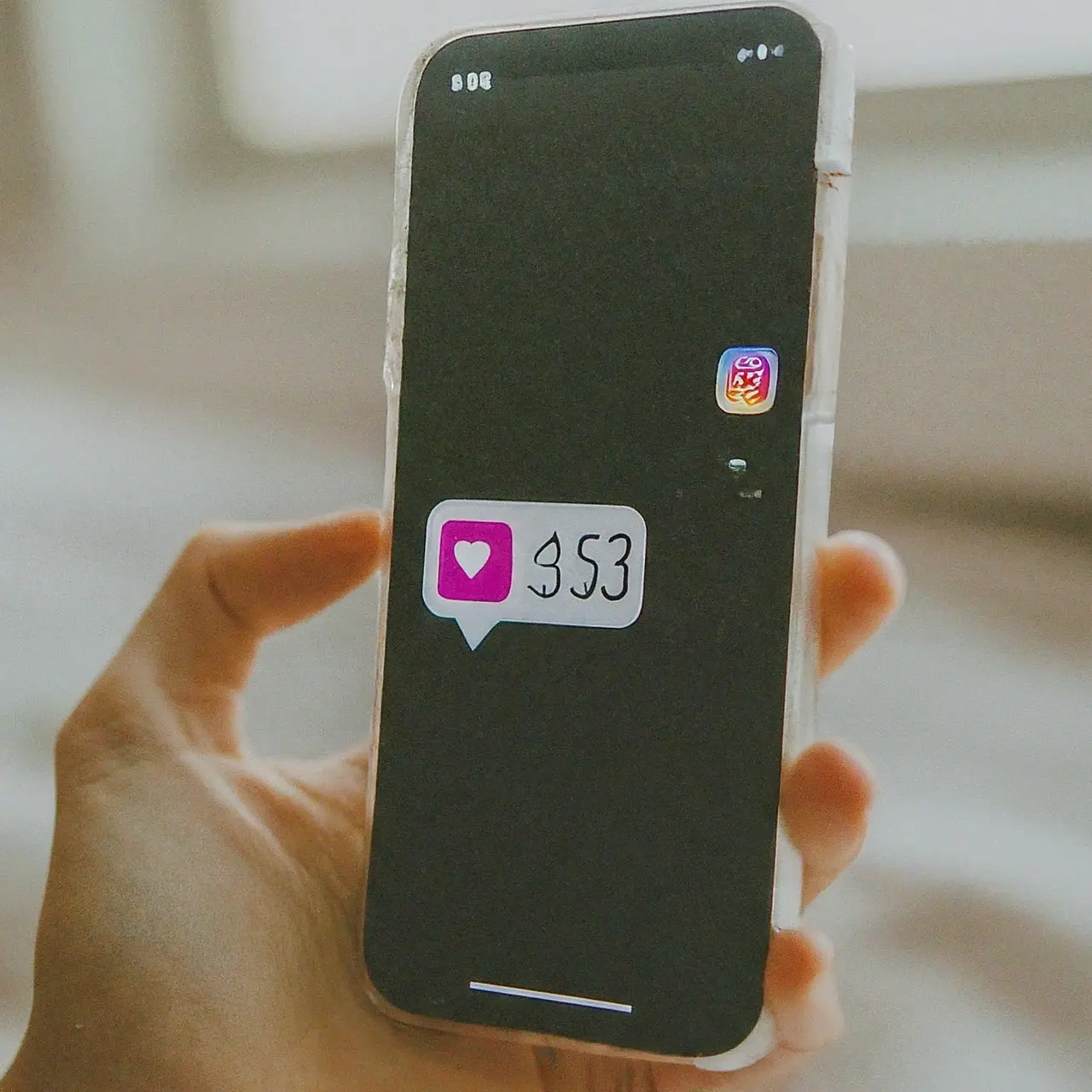 A smartphone displaying Instagram likes and comments notifications. 35mm stock photo