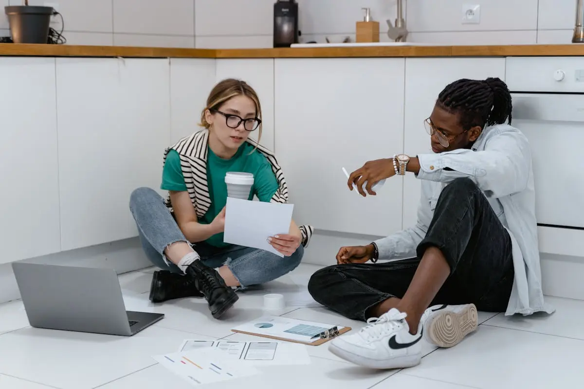 Colleagues Sitting on the Floor while Brainstorming