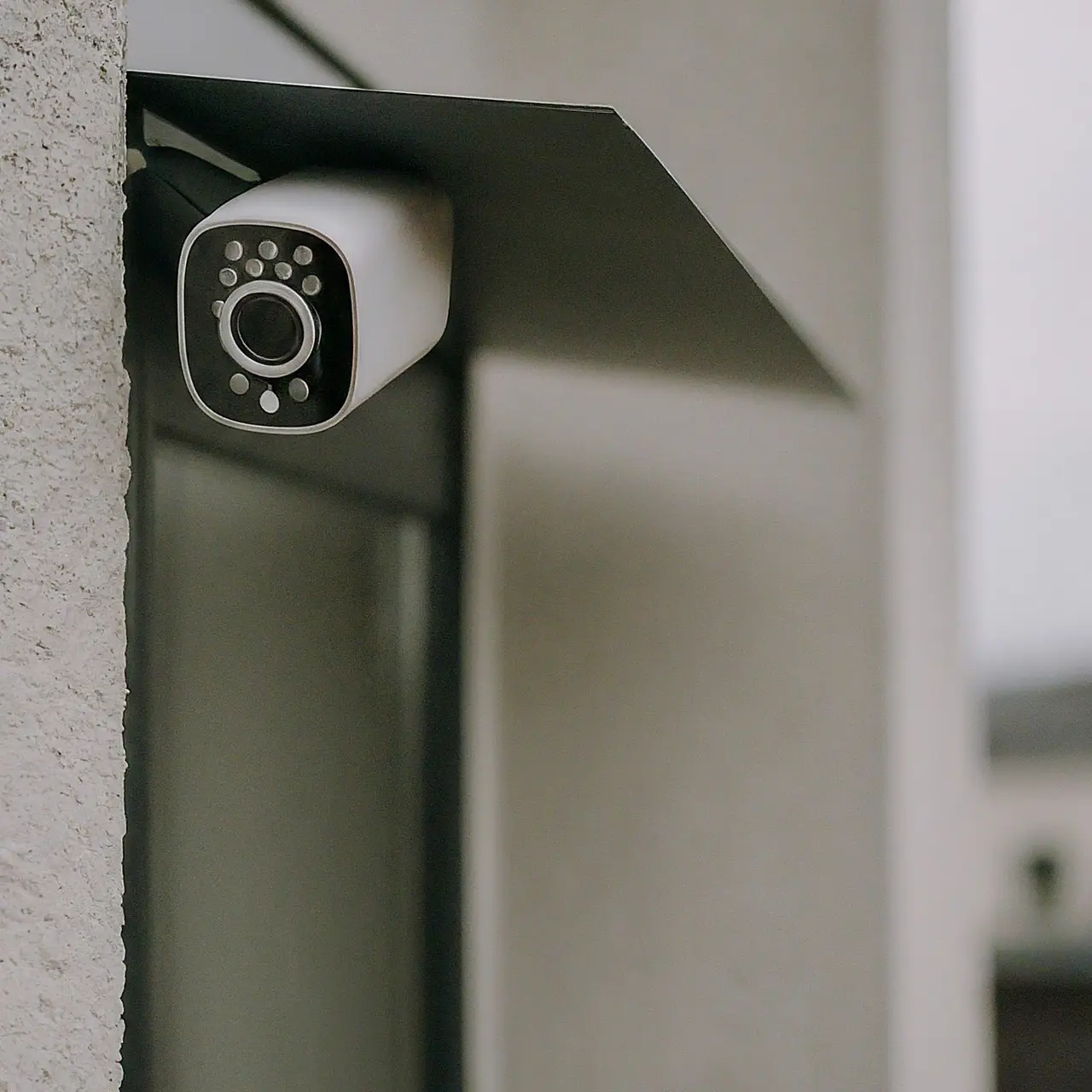 A modern home security camera connected to a wireless network. 35mm stock photo