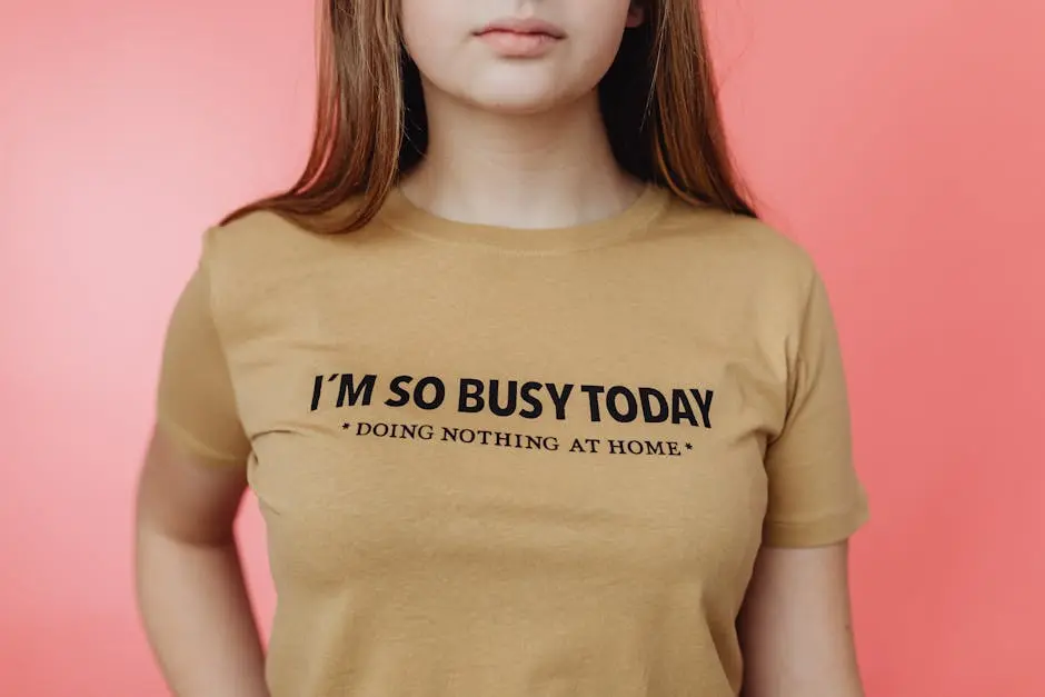 Close-up of a woman wearing a humorous t-shirt with the text ‘I’m so busy today.’