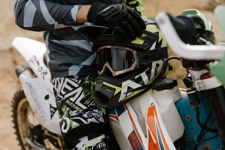 A Person Holding Black and Green Motorcycle Helmet