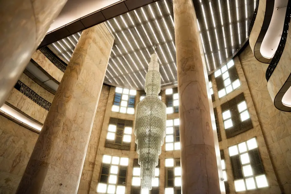 Elegant marble interior with a stunning crystal chandelier and architectural details.