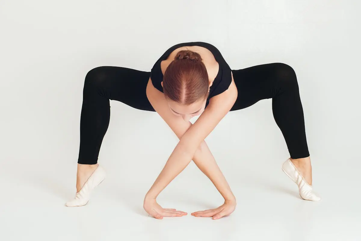 Flexible woman doing yoga in studio