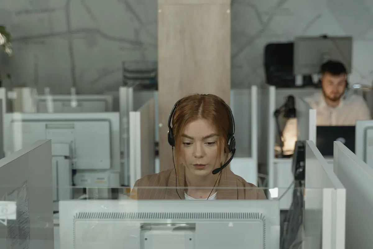 A Woman in Brown Blazer Working in the Office