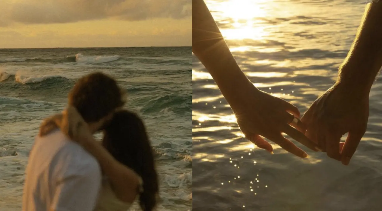 couple on the beach holding hands with eternity rings