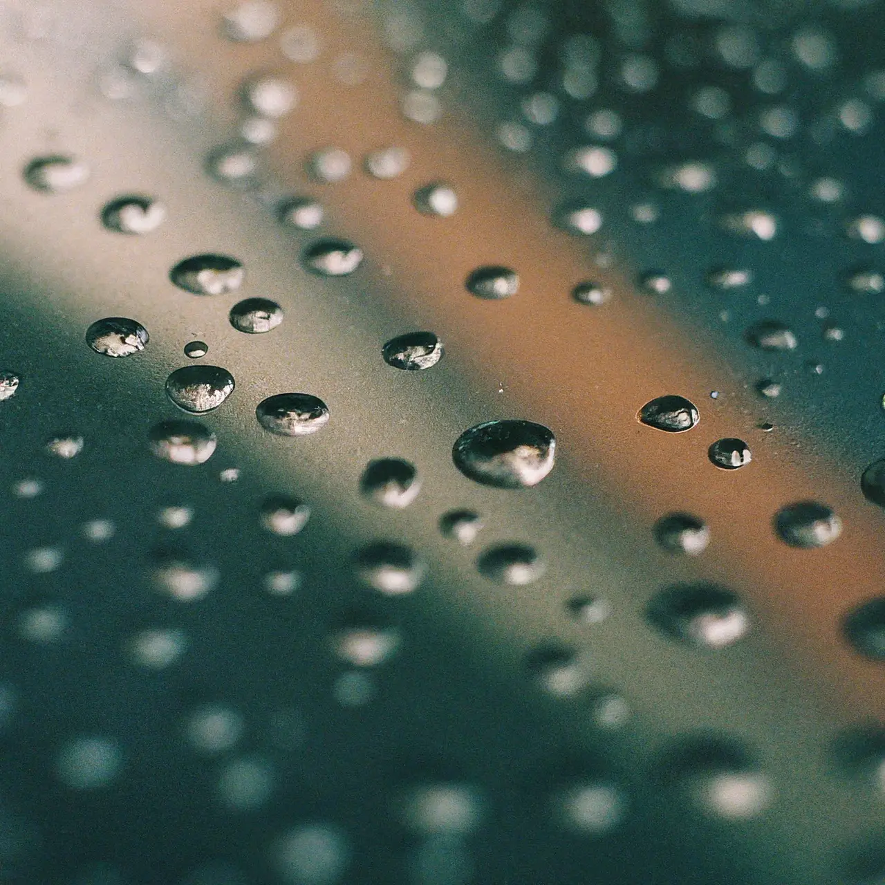 Close-up of water droplets on a high-tech digital display. 35mm stock photo