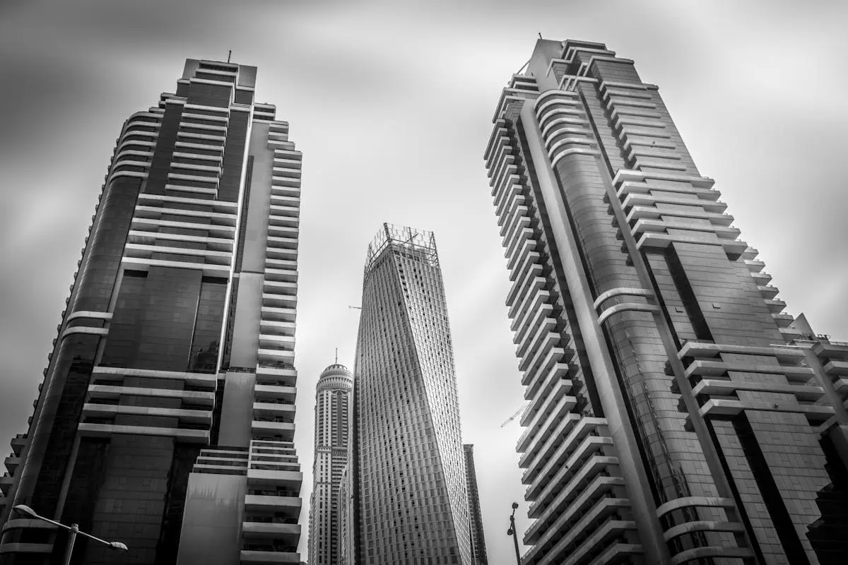 Black and white view of modern skyscrapers in Dubai’s cityscape.