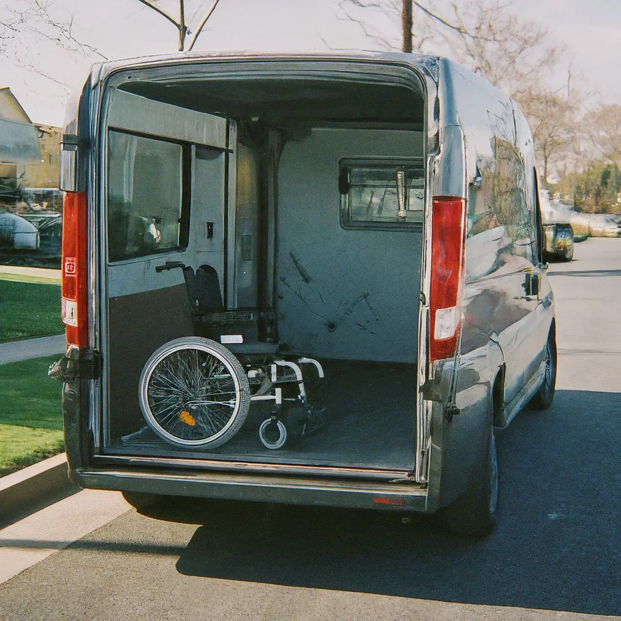 Wheelchair accessible van on a sunny suburban street. 35mm stock photo