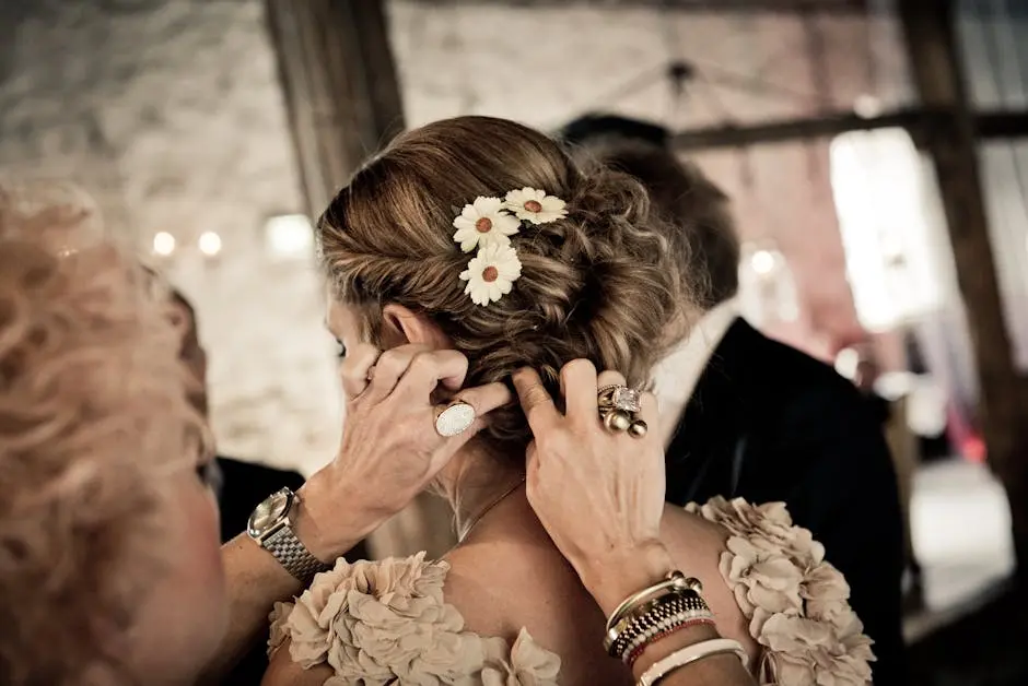 Close-up of hairstyling for a bride with floral accents, creating an elegant wedding look.