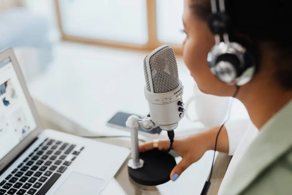 Woman with Headset Speaking over a Condenser Microphone