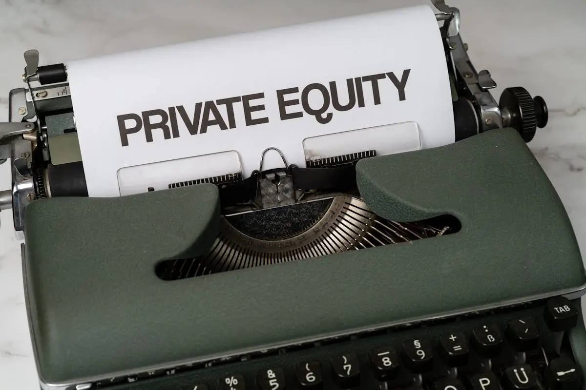 Close-up of vintage typewriter with ‘PRIVATE EQUITY’ on paper, business concept.