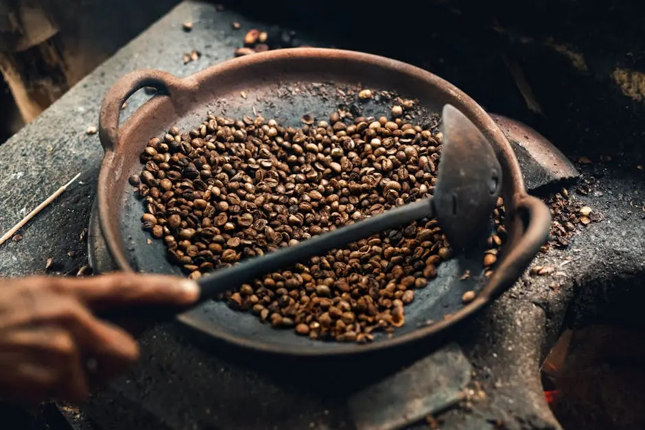 Traditional coffee roasting process over an open flame in Bali, Indonesia.