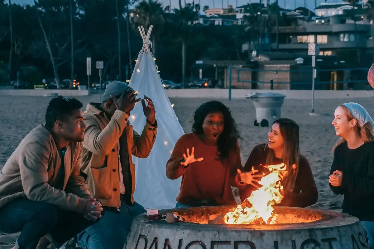 Group of Friends Sitting in Front of Fire Pit