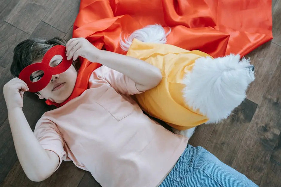 A Boy Wearing a Cape and a Mask Lying on the Floor