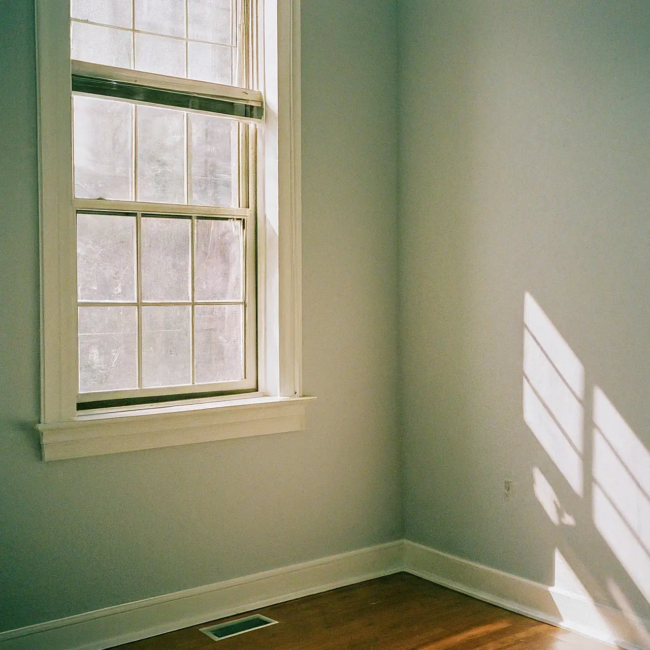 A sparkling clean, empty apartment with sunlight streaming in. 35mm stock photo