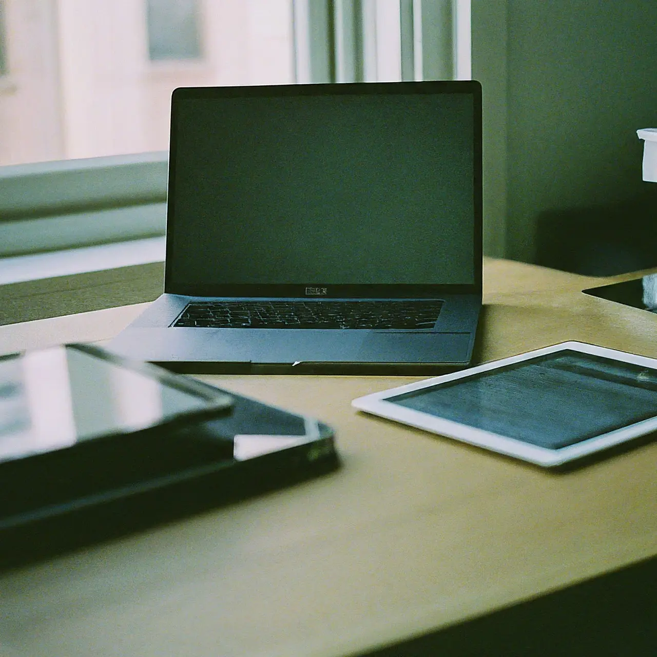 Laptops and digital tablets on a high-tech office desk. 35mm stock photo