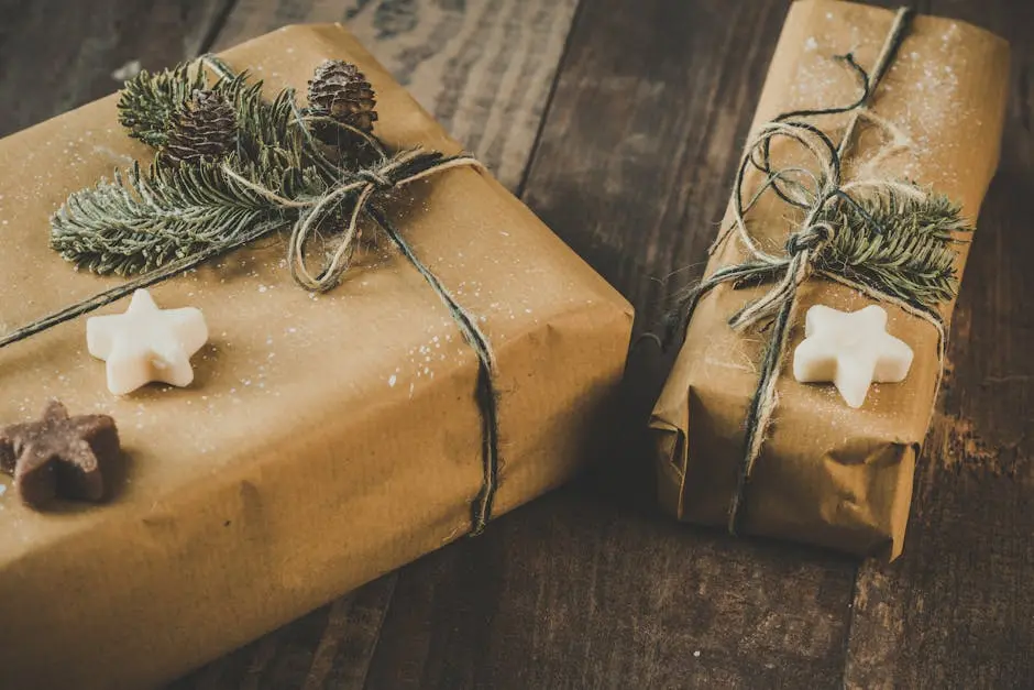 Two eco-friendly Christmas presents wrapped in brown kraft paper with pine decorations on a wooden table.