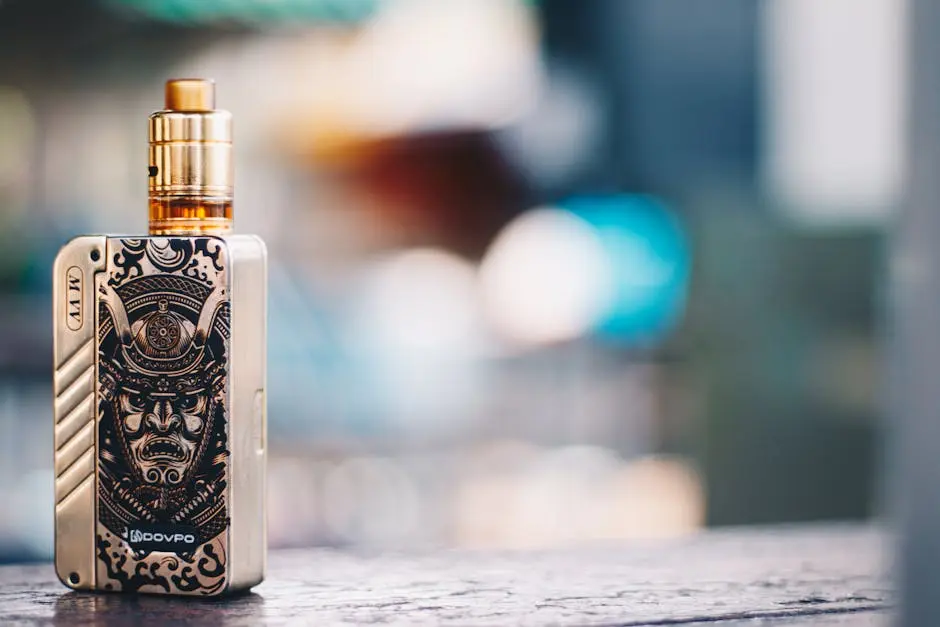 Close-up of a vape device with samurai design, set against a blurred background in Bangkok.