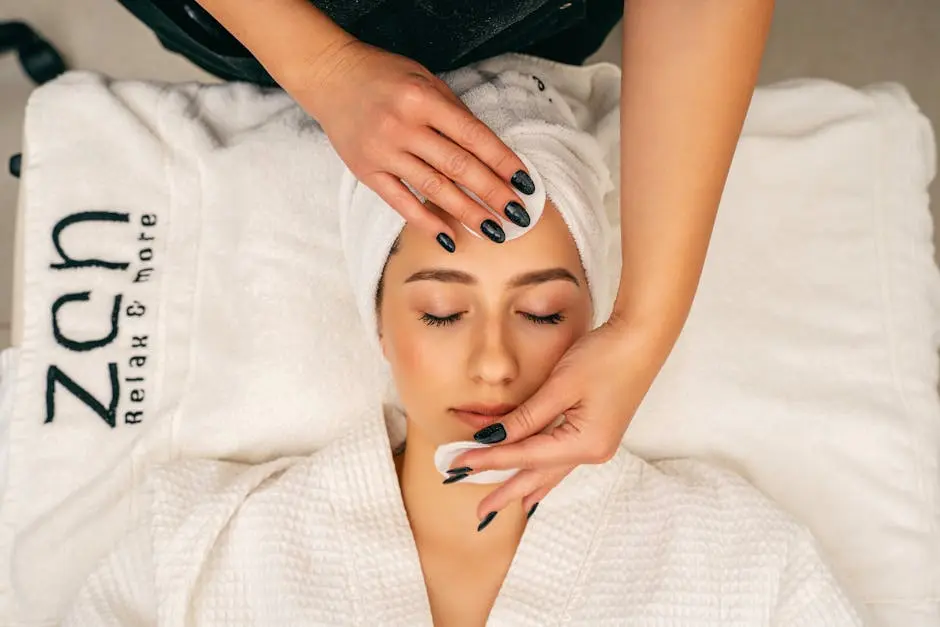 A woman receiving a soothing facial massage at Zen spa for relaxation and skincare.