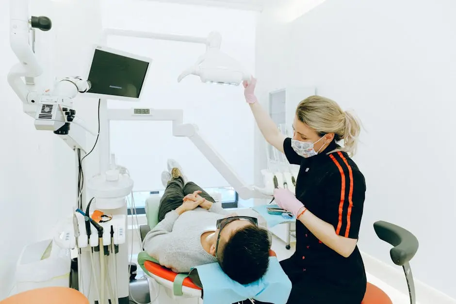 Female dentist examines patient’s teeth in modern clinic setting.