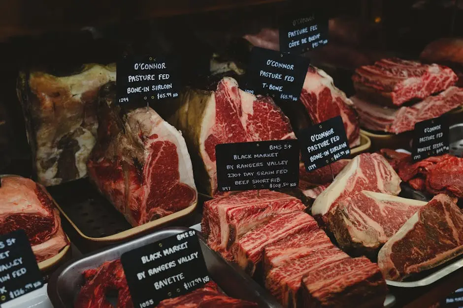 Assorted premium beef cuts with labels showcased in a gourmet market setting.