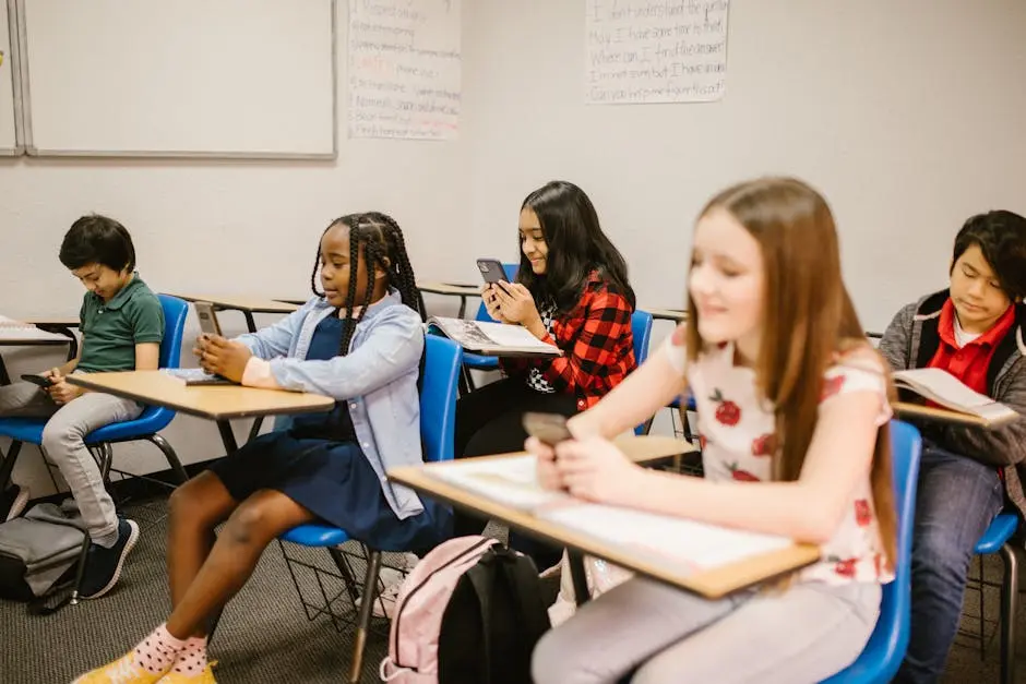 A group of children using mobile devices in a classroom setting, symbolizing learning and technology integration.