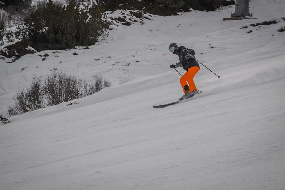 A Skier Skiing Down the Mountain