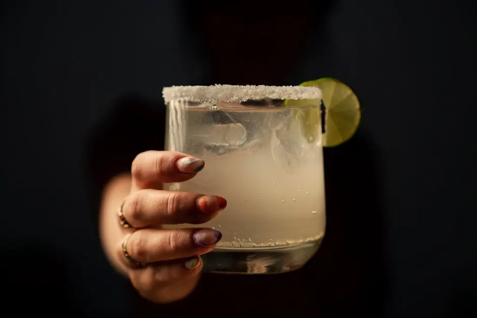 A Person Holding a Glass Cup with Margarita