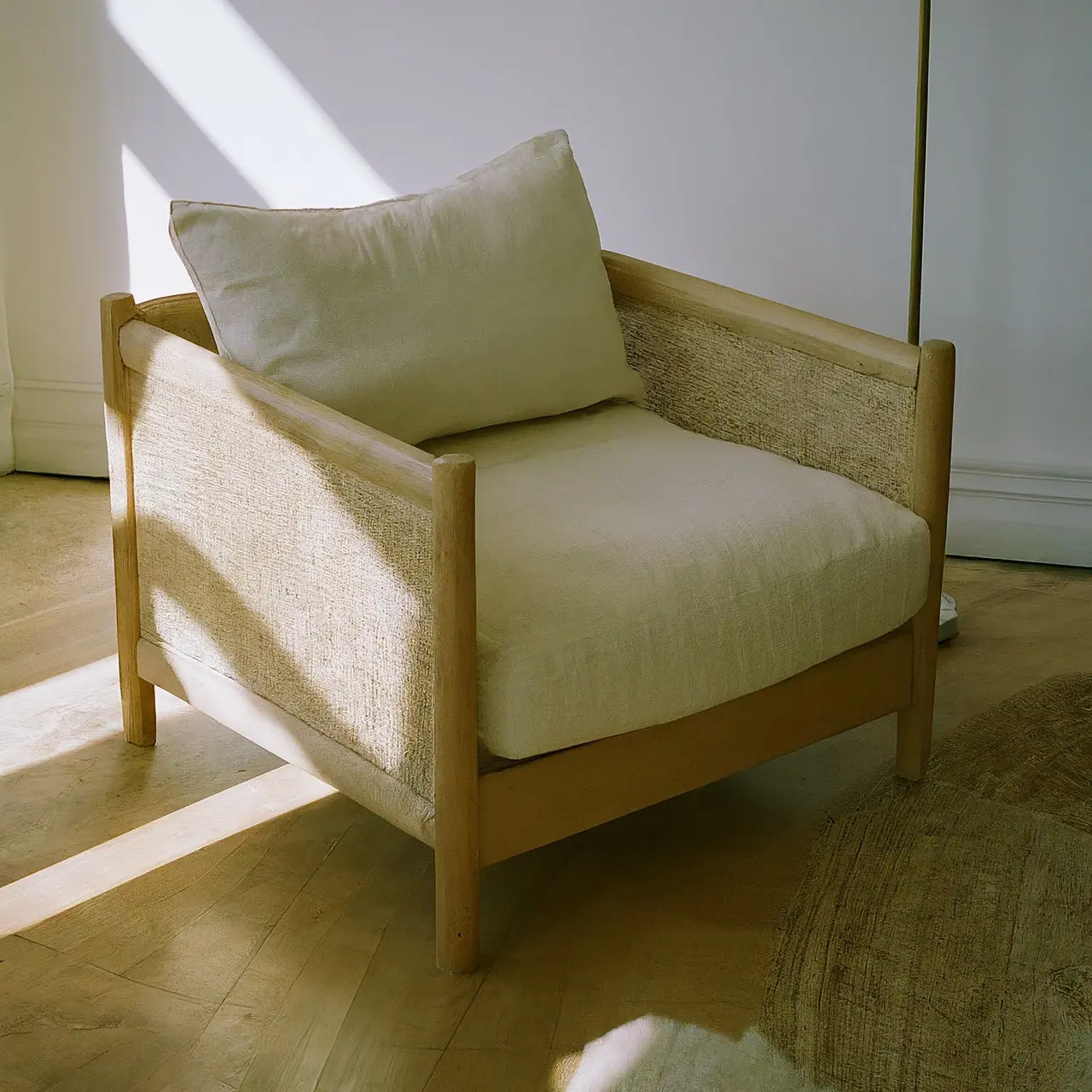 Natural-fiber furniture in a sunlit, eco-friendly living room. 35mm stock photo