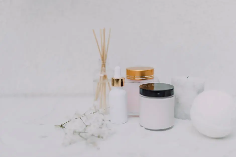 Elegant minimalistic display of skincare products and aromatherapy essentials on a clean white background.