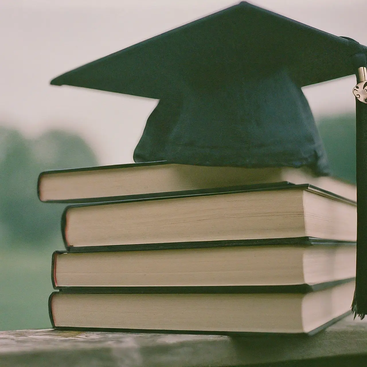 A graduation cap on top of psychology textbooks. 35mm stock photo