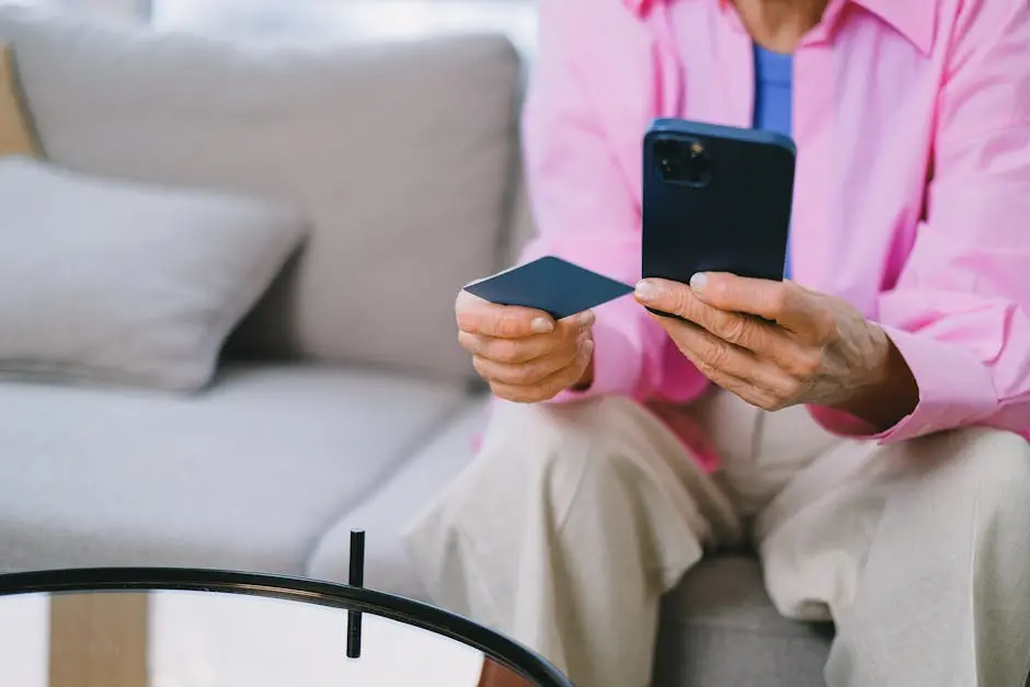 Person using Smartphone and Credit Card