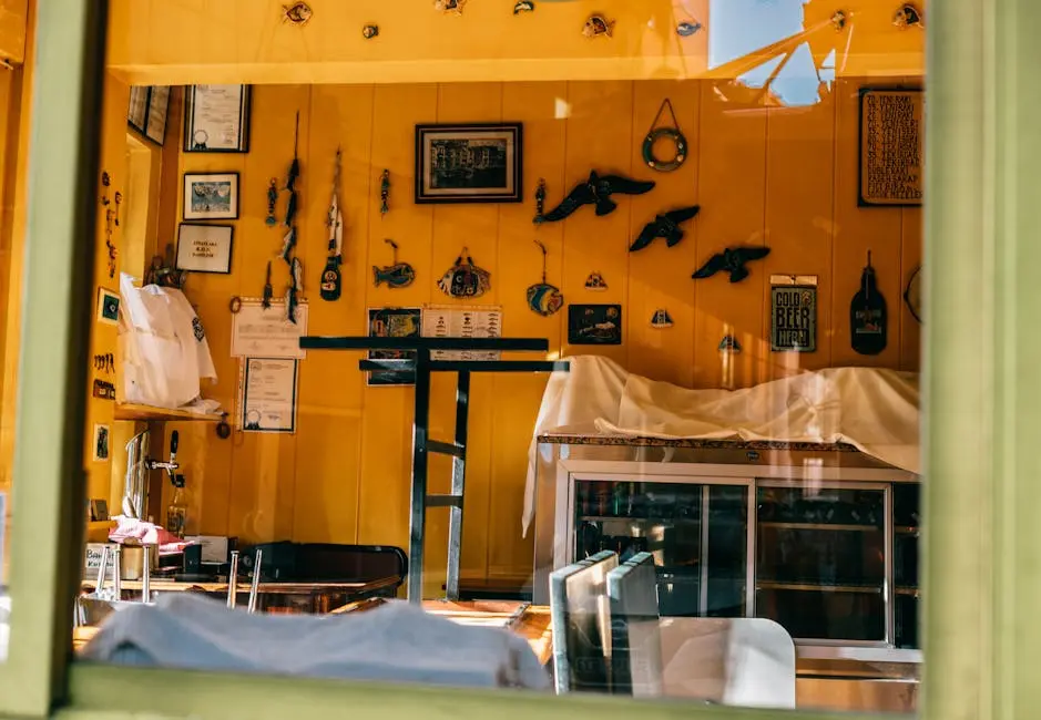 Charming and cozy café interior in Istanbul with vibrant yellow walls and artistic decorations.