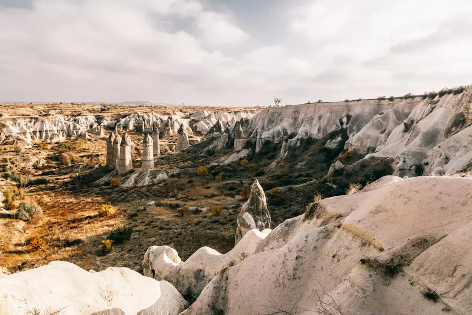 Explore the unique rock formations and stunning landscape of Cappadocia, Turkey.