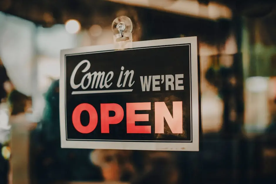 Charming open sign displayed at a shop, inviting customers inside a welcoming retail environment.