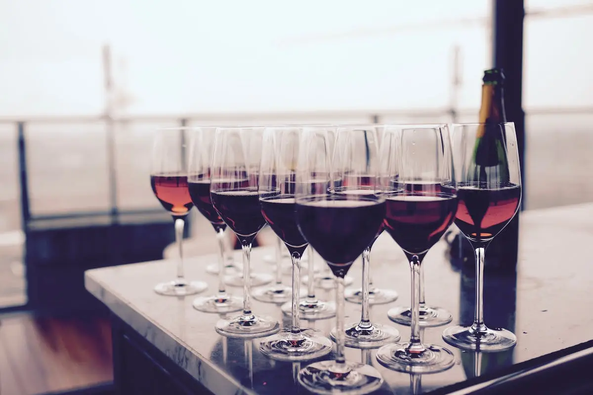 Wine Glass With Red Liquid on Black Table