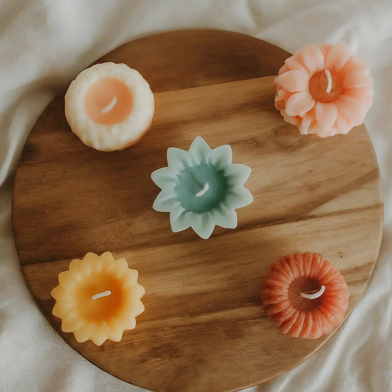 A collection of colorful wax melts on a wooden surface. 35mm stock photo