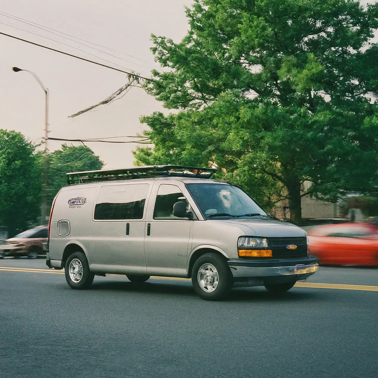 A wheelchair accessible van driving through Clifton, New Jersey. 35mm stock photo